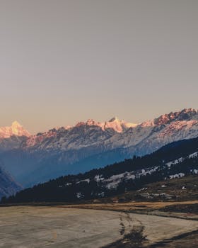 Stunning view of snow-covered mountains in Auli, India during sunset.