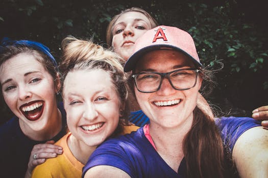 pexels-photo-1037989-1037989 A joyful group of women taking a selfie outdoors, showcasing happiness and friendship.