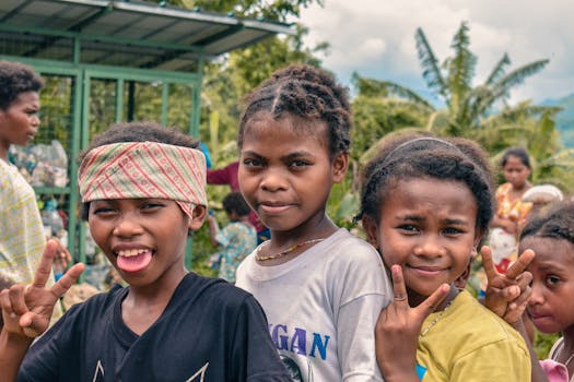 A group of smiling children posing outdoors in Floridablanca, Central Luzon, Philippines.