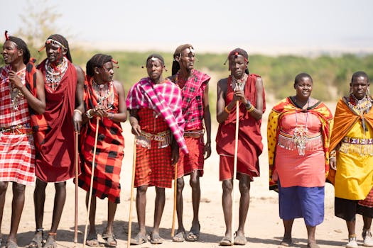 Maasai people in traditional attire, Kenya, showcasing vibrant cultural heritage outdoors.