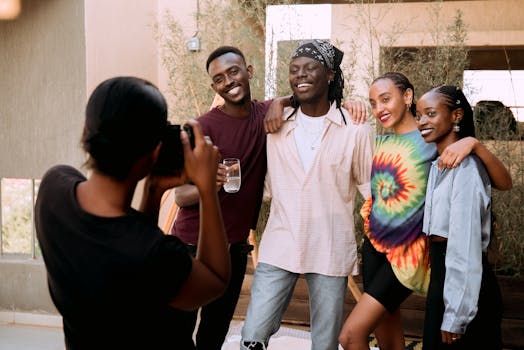 A lively group of friends enjoying a photo moment on a sunny day, embodying joy and friendship.